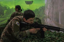 An Army soldier interacts with a Korean weapons simulation in South Korea last fall. An Army soldier interacts with a Korean weapons simulation in South Korea last fall.
