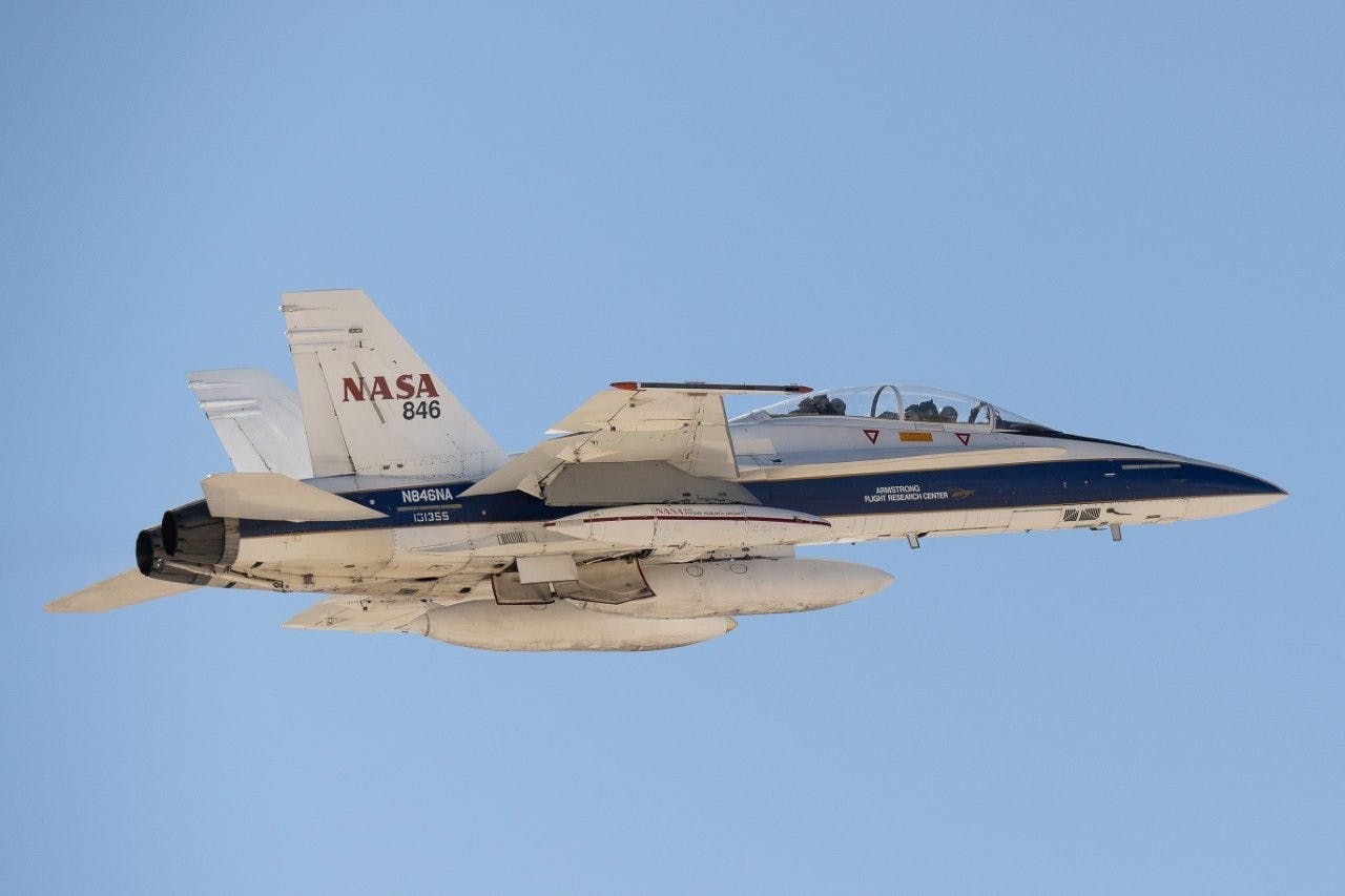 The Psionic Space Navigation Doppler Lidar (PSNDL) system is installed in a pod located under the right wing of a NASA F/A-18 research aircraft for flight testing above Death Valley near NASA&rsquo;s Armstrong Flight Research Center in Edwards, California, in February 2025. NASA