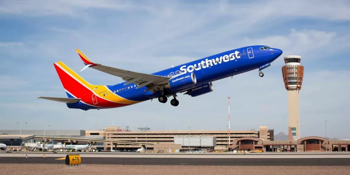 A Southwest airplane taking off from an airport