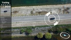 Digital composite video depicts a reconnaissance uncrewed aircraft as it keeps watch on moving vehicles. Digital composite video depicts a reconnaissance uncrewed aircraft as it keeps watch on moving vehicles.