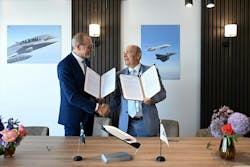 A Dassault representative shaking hands with an European Space Agency rep. A Dassault representative shaking hands with an European Space Agency rep.
