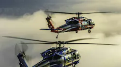 Two Black Hawk helicopters flying.