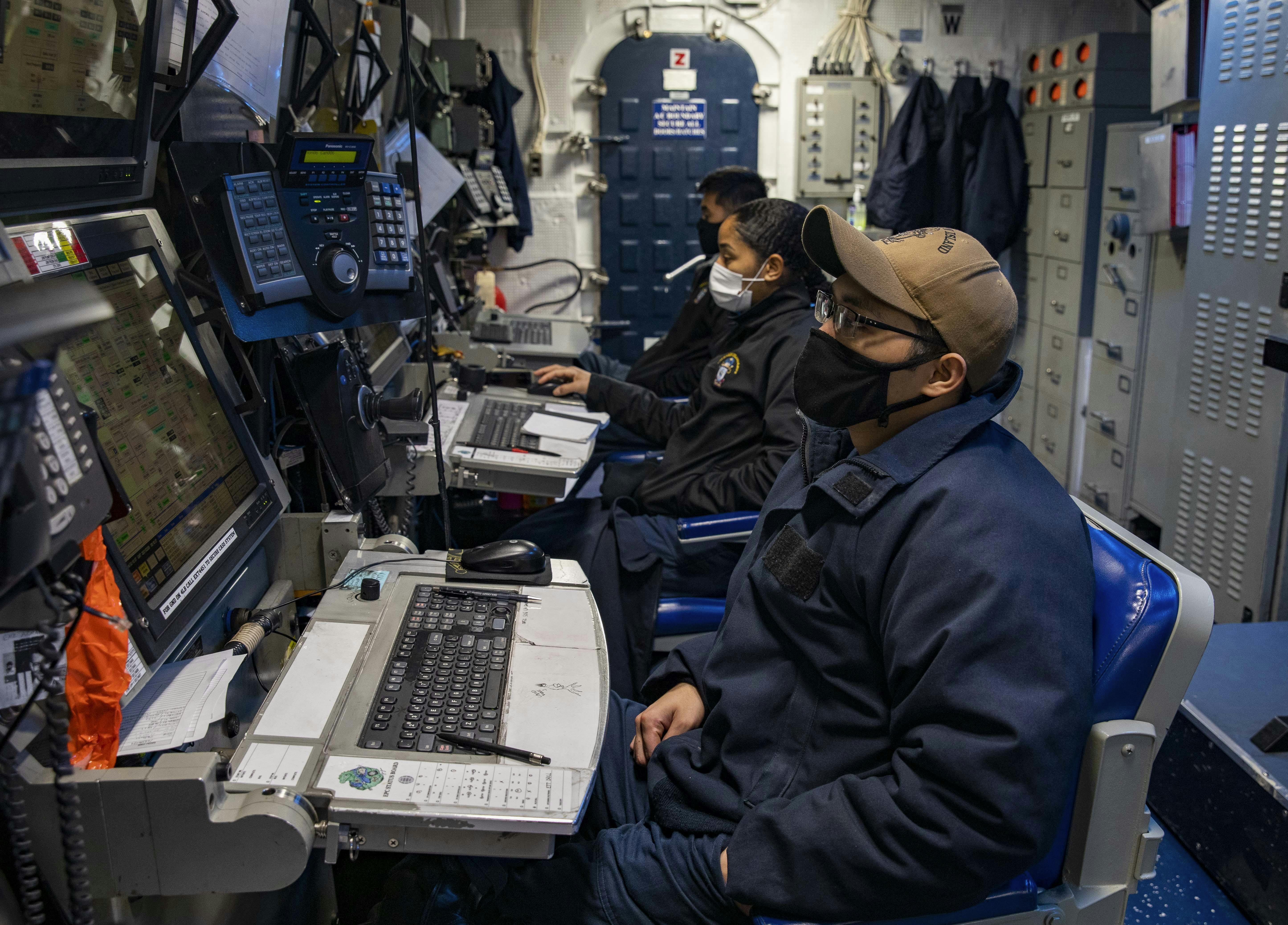 U.S. Sailors monitor propulsion and other vital ship functions from the central control station aboard the amphibious assault ship USS Makin Island (LHD 8)