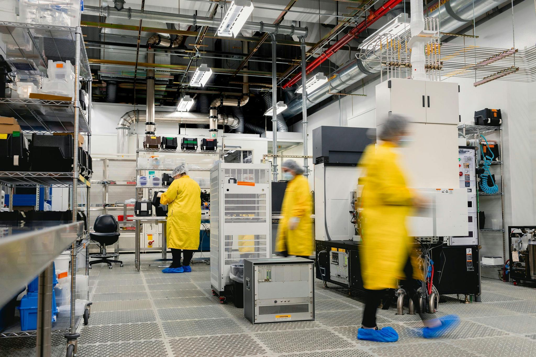 Workers in a clean room and electronics