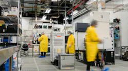 Workers in a clean room and electronics