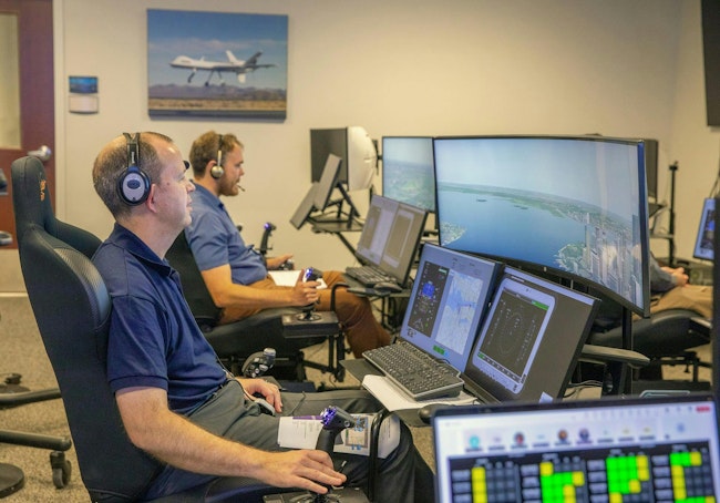 Andy Burroughs (left) and Paul Friz in the roles of air taxi pilots running through air taxi integration simulations focusing on urban air space at NASA’s Langley Research in Hampton, Virginia on 25 Sept. 2024. NASA photo.