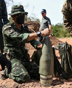 A Royal Thai Army artilleryman wraps a 155 millimeter white phosphorus artillery round with detonation cord for large scale detonation during Exercise Cobra Gold in 2021. A Royal Thai Army artilleryman wraps a 155 millimeter white phosphorus artillery round with detonation cord for large scale detonation during Exercise Cobra Gold in 2021.