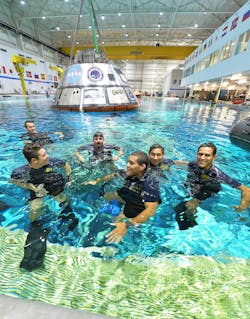 U.S. Navy divers are training in the Neutral Buoyancy Laboratory at NASA’s Johnson Space Center in Houston using a test version of the Orion spacecraft. U.S. Navy divers are training in the Neutral Buoyancy Laboratory at NASA’s Johnson Space Center in Houston using a test version of the Orion spacecraft.