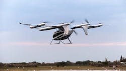 AutoFlight's CarryAll evtol hovers above a landing pad AutoFlight's CarryAll evtol hovers above a landing pad