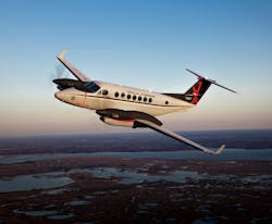 The Beechcraft 360ER in flight over a landscape. The Beechcraft 360ER in flight over a landscape.