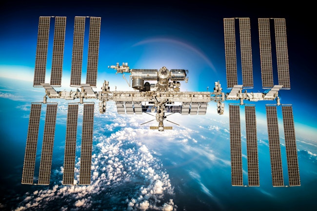 A photo of the ISS in orbit around Earth.