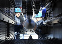 Sailors aboard the aircraft carrier USS Gerald R. Ford (CVN 78) practice loading an inert-dummy RIM-162 Evolved SeaSparrow Missile into a launcher. Sailors aboard the aircraft carrier USS Gerald R. Ford (CVN 78) practice loading an inert-dummy RIM-162 Evolved SeaSparrow Missile into a launcher.