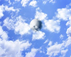 A weather balloon floats below clouds as shot from below. A weather balloon floats below clouds as shot from below.