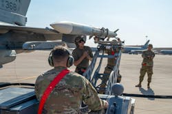 Air Force airmen load an AIM-120 advanced medium-range air-to-air missile (AMRAAM) at Prince Sultan Air Base Kingdom of Saudi Arabia. Air Force airmen load an AIM-120 advanced medium-range air-to-air missile (AMRAAM) at Prince Sultan Air Base Kingdom of Saudi Arabia.