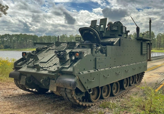 A 3rd Infantry Division Armored Multi-Purpose Vehicle drives off of a barge during a wet-gap crossing exercise on Fort Stewart, Ga., in 2021.