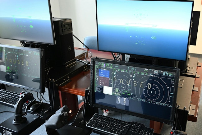 Desktop trainers display naval aviation's new carrier-based joint air training program in a lab at the Naval Air Warfare Center Aircraft Division near its Patuxent River Naval Air Station, Md., in 2024.