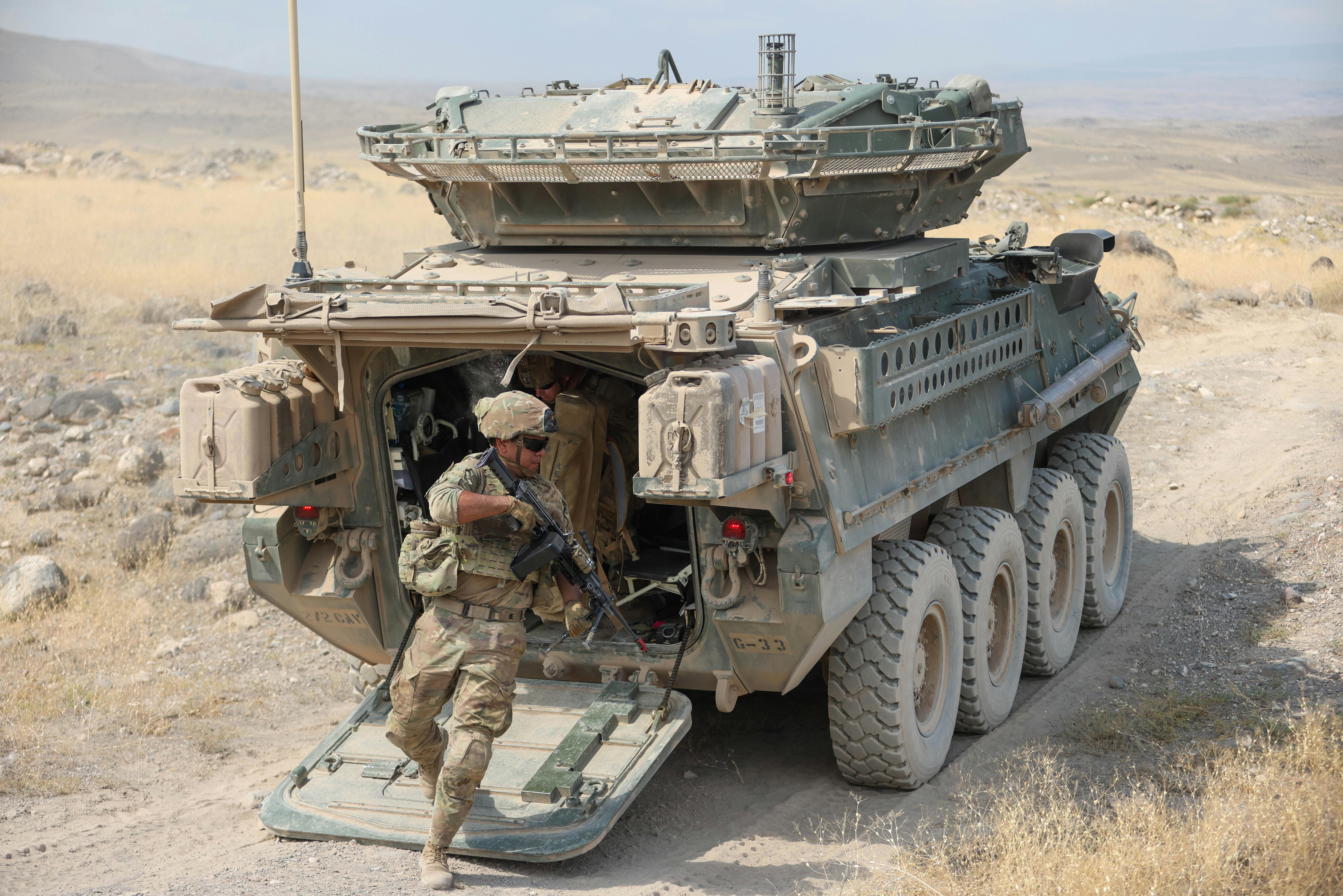 Army soldiers exit a 30-millimeter Stryker Infantry Carrier Vehicle during a team fire lane at in Armavir, Armenia, in July 2024.