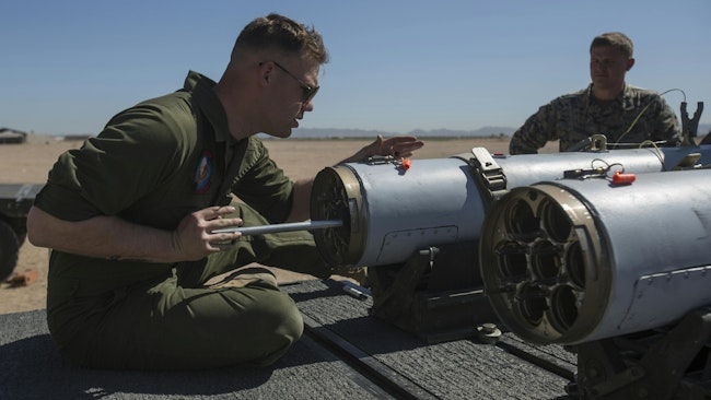 A U.S. Marine aviation ordnance system technician loads a 2.75-inch rocket configured with Advanced Precision Kill Weapon System II into an LAU-68 F/A rocket launcher at Yuma Marine Corps Air Station, Ariz., last March.