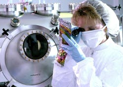 Sandra Fries-Carr analyzes the diamond-like carbon film deposited on foil in the Air Force Research Laboratory propulsion directorate's power division. Air Force photo. Sandra Fries-Carr analyzes the diamond-like carbon film deposited on foil in the Air Force Research Laboratory propulsion directorate's power division. Air Force photo.