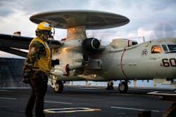 A Navy aviation boatswain’s mate signals to an E-2D Hawkeye radar surveillance aircraft earlier this month aboard the aircraft carrier USS Gerald R. Ford. A Navy aviation boatswain’s mate signals to an E-2D Hawkeye radar surveillance aircraft earlier this month aboard the aircraft carrier USS Gerald R. Ford.