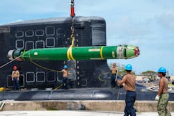 Crewmen aboard the Virginia-class submarine USS Minnesota (SSN 783) guide a Mark 48 ADCAP torpedo during a weapons offload at Guam Naval Base last February. Crewmen aboard the Virginia-class submarine USS Minnesota (SSN 783) guide a Mark 48 ADCAP torpedo during a weapons offload at Guam Naval Base last February.