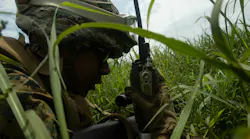 A U.S. Marine Corps expeditionary fuel technician establishes communications using a radio as part of an exercise at Ie Shima, Okinawa, Japan, last May.