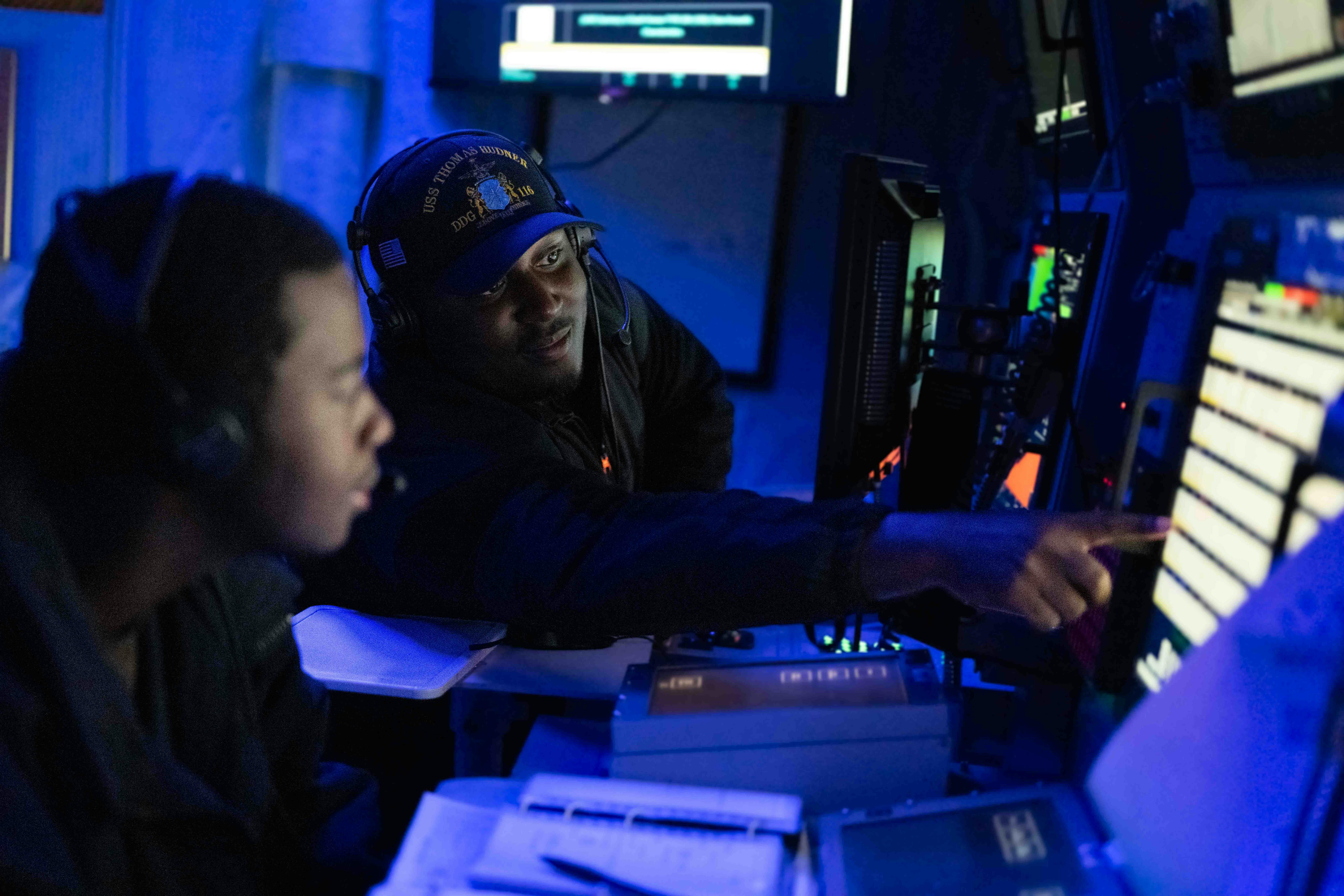 A Navy surface sonar technician aboard the Arleigh Burke-class guided-missile destroyer USS Thomas Hudner (DDG 116) operates a sonar console during a recent submarine exercise.