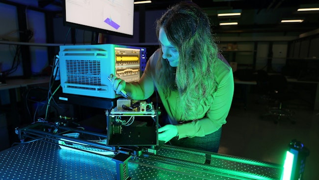 Air Force researcher Clair Parisi measures channel impulse response at 140 GHz on an experimental communications radio. The Air Force Research Lab is leading the area of wireless communications in underused parts of radio spectrum such as frequencies above 100 GHz.