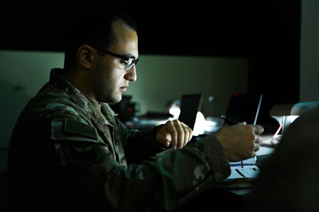 A U.S. Air Force airman reviews a checklist in the wing operations center during exercise Ulchi Freedom Shield 25 at Daegu Air Base, Republic of Korea, last August.