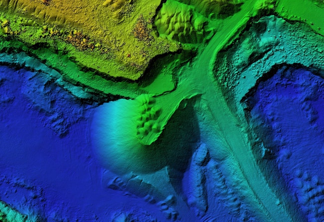 Digital elevation model of a quarry for GIS usage. Model of a mine elevation. GIS product made after processing aerial pictures taken from a drone. It shows excavation site with steep rock walls