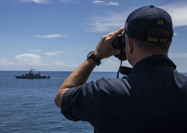 The captain of the Arleigh Burke-class guided-missile destroyer USS Rafael Peralta (DDG 115) monitors the Royal Thai Navy warship HTMS Rattanakosin (FSGM 441) during a transiting exercise in June 2023.