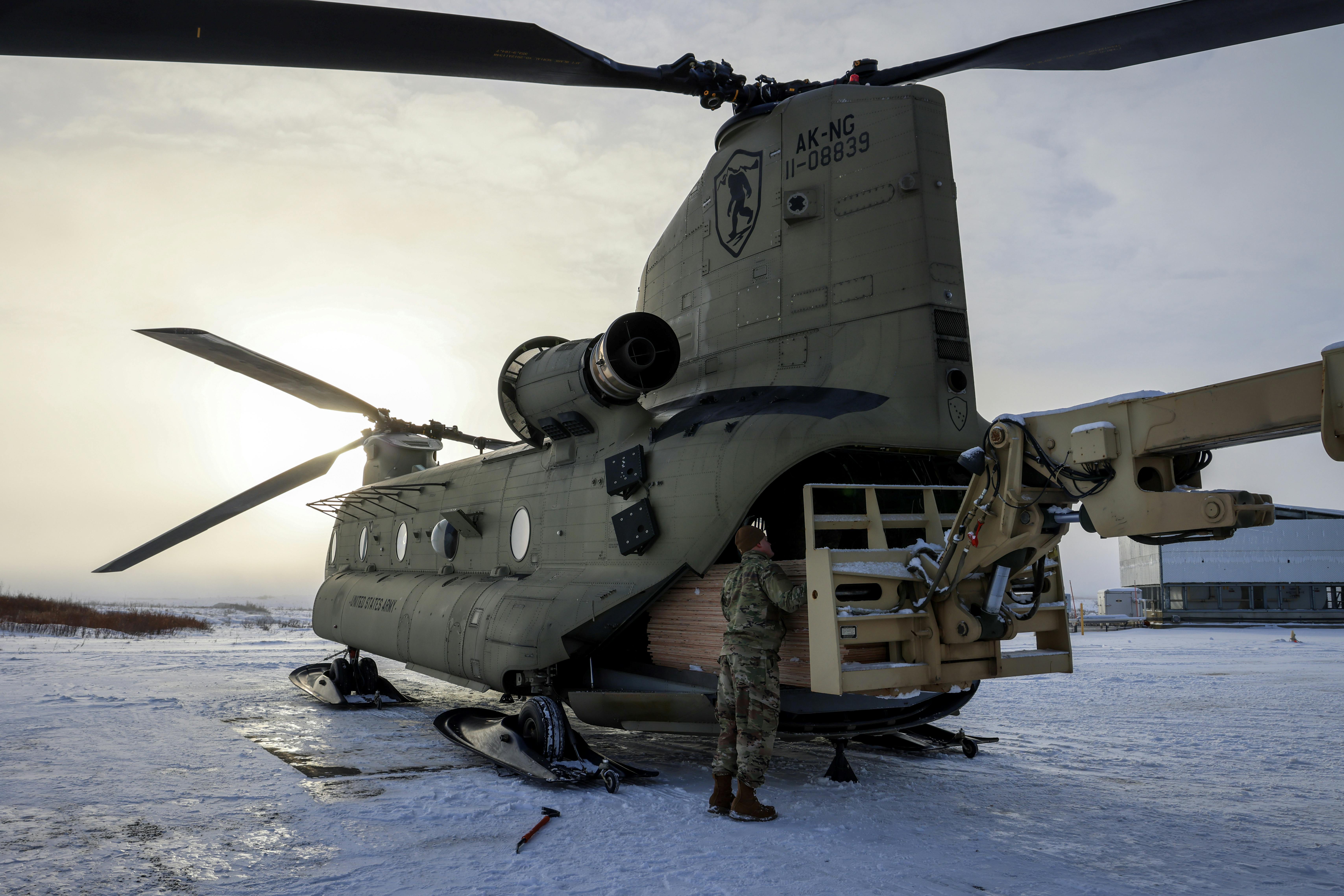 Alaska Organized Militia members prepare Alaska Army National Guard helicopters to transport building supplies to Western Alaskan communities earlier this month.