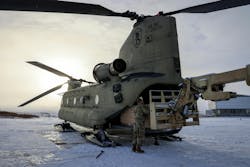 Alaska Organized Militia members prepare Alaska Army National Guard helicopters to transport building supplies to Western Alaskan communities earlier this month. Alaska Organized Militia members prepare Alaska Army National Guard helicopters to transport building supplies to Western Alaskan communities earlier this month.