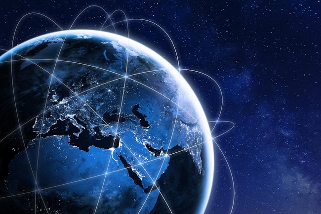 Europe, North Africa, South- and south-western Asia from space at night with a technological network shown over it.