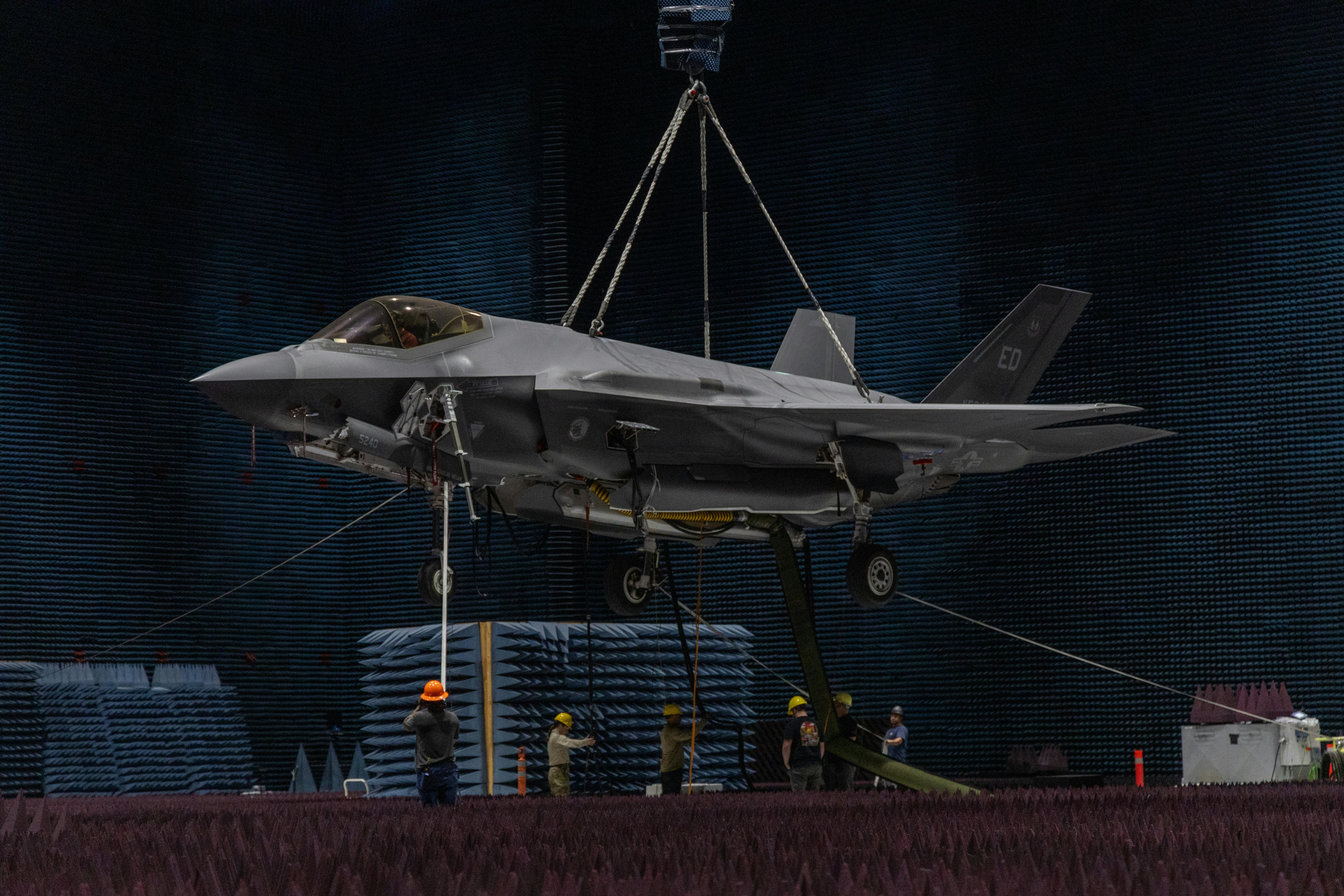 Technicians from the Air Force 412th Electronic Warfare Group position an F-35A combat jet in the Benefield Anechoic Facility at Edwards Air Force Base last May. Air Force photo