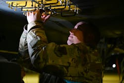 An Air Force airman installs a countermeasure firing pulse tester into a U.S. Air Force F-15E Strike Eagle at RAF Lakenheth, England, last May to assess EW defensive system readiness. Air Force photo An Air Force airman installs a countermeasure firing pulse tester into a U.S. Air Force F-15E Strike Eagle at RAF Lakenheth, England, last May to assess EW defensive system readiness. Air Force photo