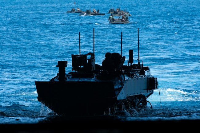 A U.S. Marine Corps amphibious combat vehicle transits into the well deck of the Wasp-class amphibious assault ship USS Boxer (LHD 4) while conducting launch and recovery operations last September.