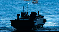 A U.S. Marine Corps amphibious combat vehicle transits into the well deck of the Wasp-class amphibious assault ship USS Boxer (LHD 4) while conducting launch and recovery operations last September.