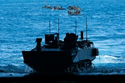 A U.S. Marine Corps amphibious combat vehicle transits into the well deck of the Wasp-class amphibious assault ship USS Boxer (LHD 4) while conducting launch and recovery operations last September. A U.S. Marine Corps amphibious combat vehicle transits into the well deck of the Wasp-class amphibious assault ship USS Boxer (LHD 4) while conducting launch and recovery operations last September.