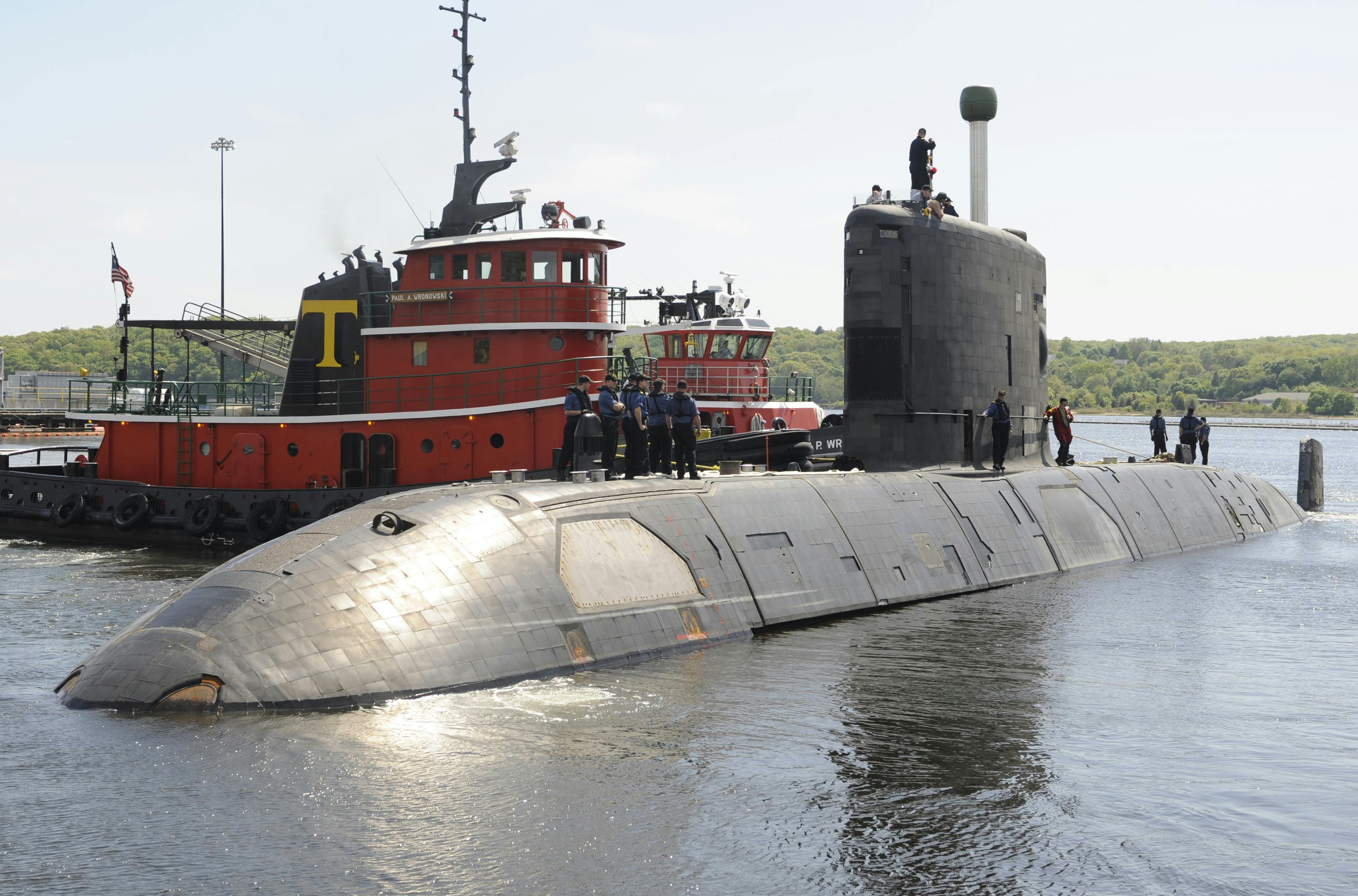 The Canadian Navy Victoria-class long-range patrol submarine HMCS Corner Brook pulls out of her berthing in 2009 at New London Submarine Base, Conn., after a five-day port visit.