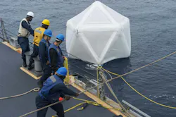 Sailors aboard the Arleigh Burke-class guided-missile destroyer USS Ramage (DDG 61) recover an inflated decoy during an initial test of the Mk-59 decoy launch system in 2014