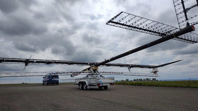 After the aircraft was rolled out of the hangar, it was mounted on its launch trolley and attached to a tow vehicle for the first time. When stationary, the wing must be supported by the trolley's 'outriggers' &ndash; as there is no aerodynamic lift to relieve the load on the aircraft's ultra-light structure. Credit: DLR (CC BY-NC-ND 3.0)