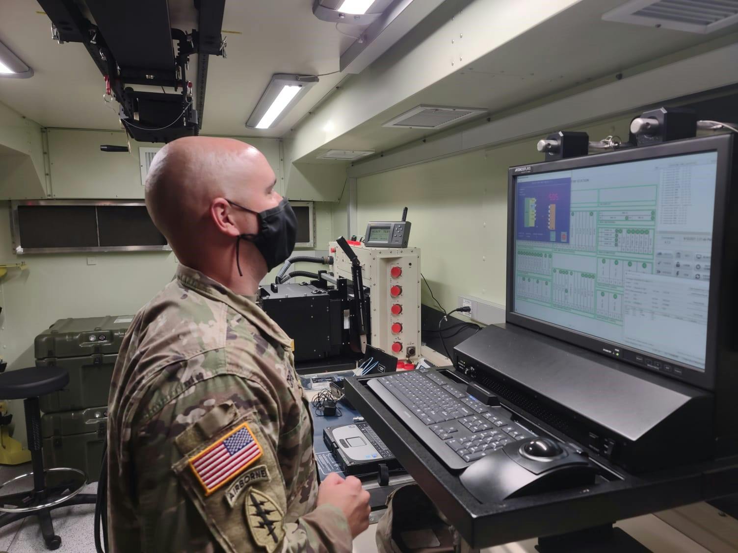 An Army electronic missile systems maintenance technician reads test step procedures during the instrument self-test on the new Next Generation Automatic Test Set at Fort Stewart, Ga., in January 2022.