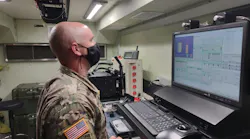 An Army electronic missile systems maintenance technician reads test step procedures during the instrument self-test on the new Next Generation Automatic Test Set at Fort Stewart, Ga., in January 2022.