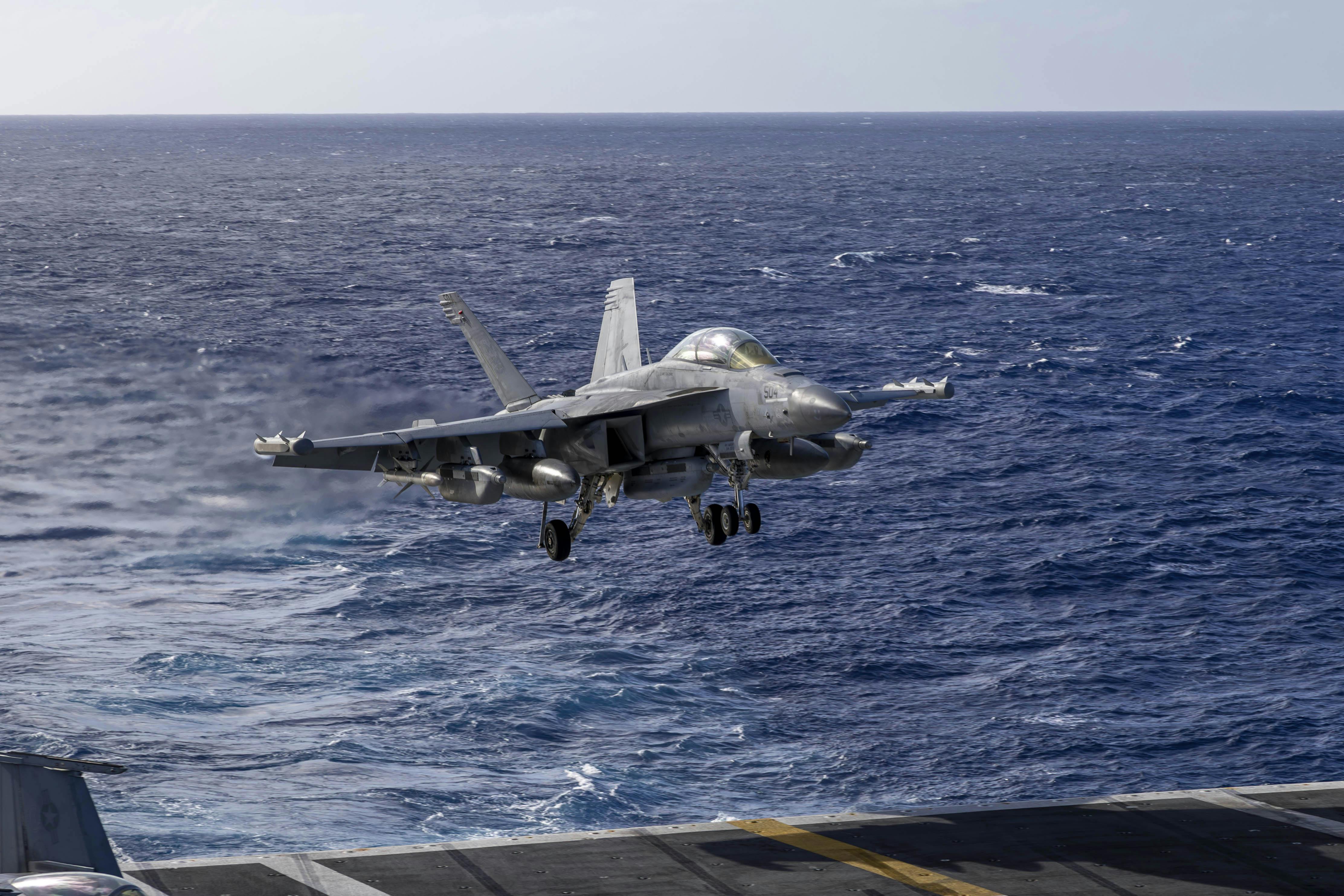 An EA-18G Growler EW jet lands on the flight deck of Nimitz-class aircraft carrier USS Abraham Lincoln (CVN 72) last December.