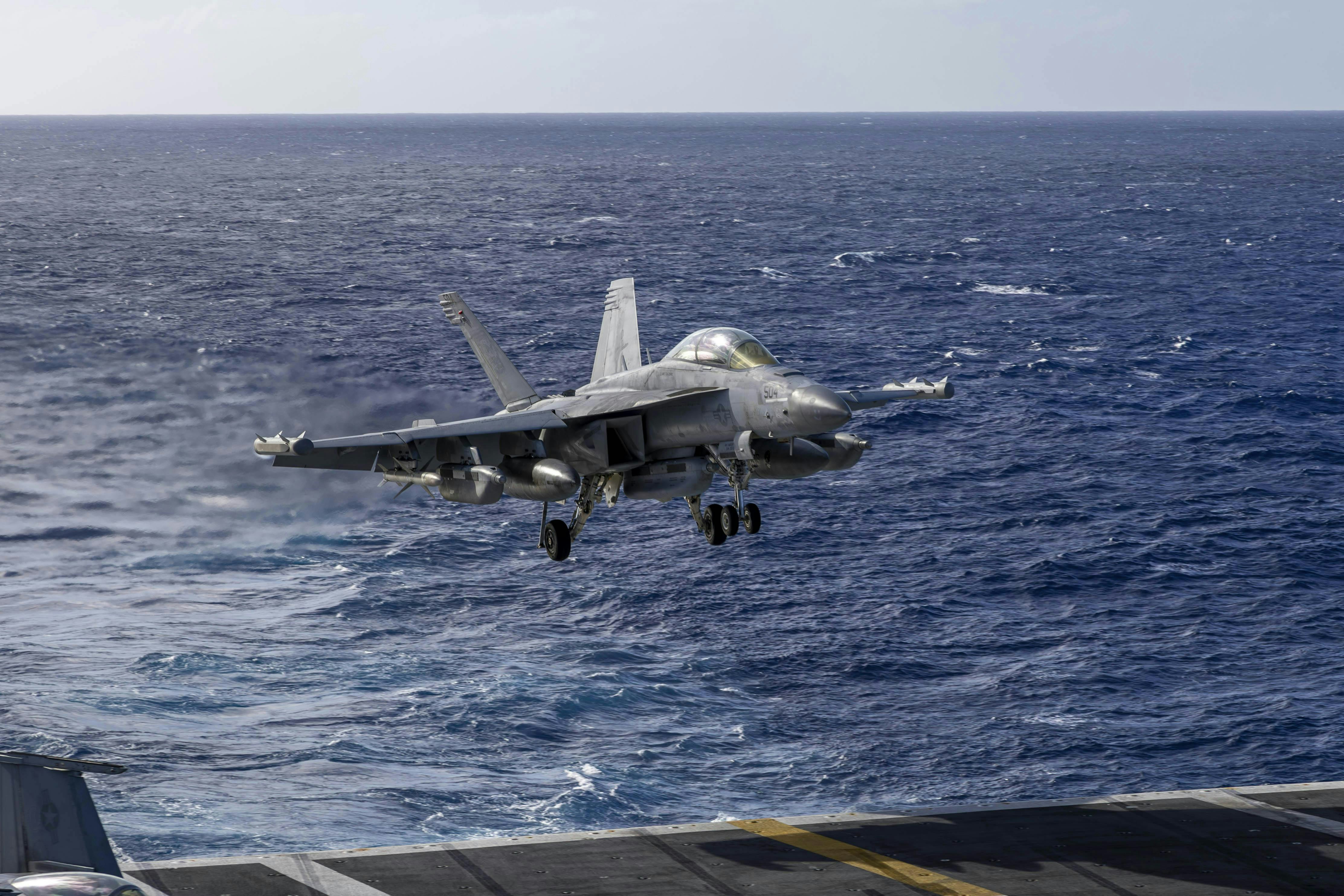 An EA-18G Growler EW jet lands on the flight deck of Nimitz-class aircraft carrier USS Abraham Lincoln (CVN 72) last December.