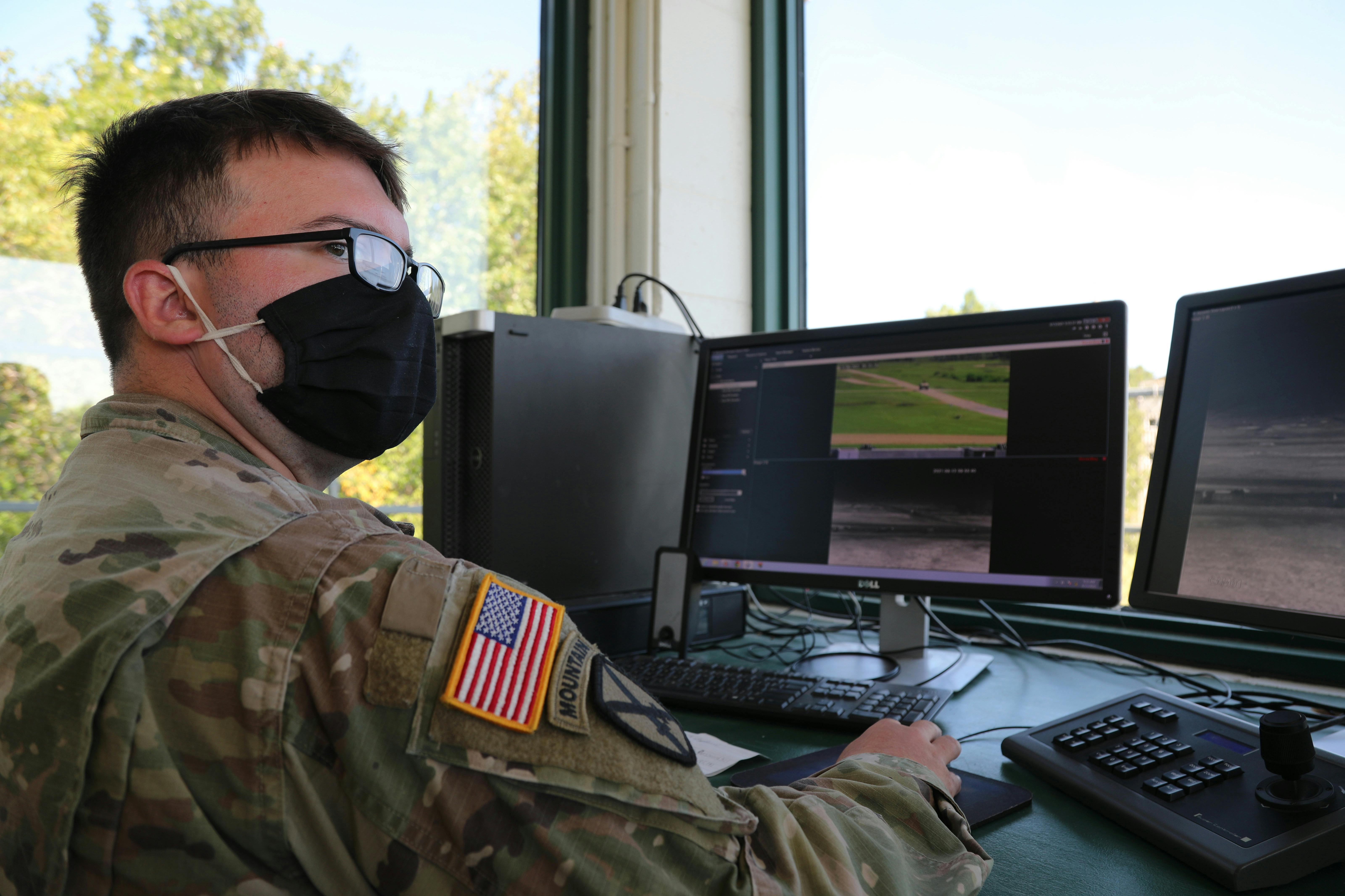 A U.S. Army operations specialist helps evaluate crew-served, vehicle-mounted weapons qualifications in 2021 at the Combat Support Training Exercise in Fort McCoy, Wis.