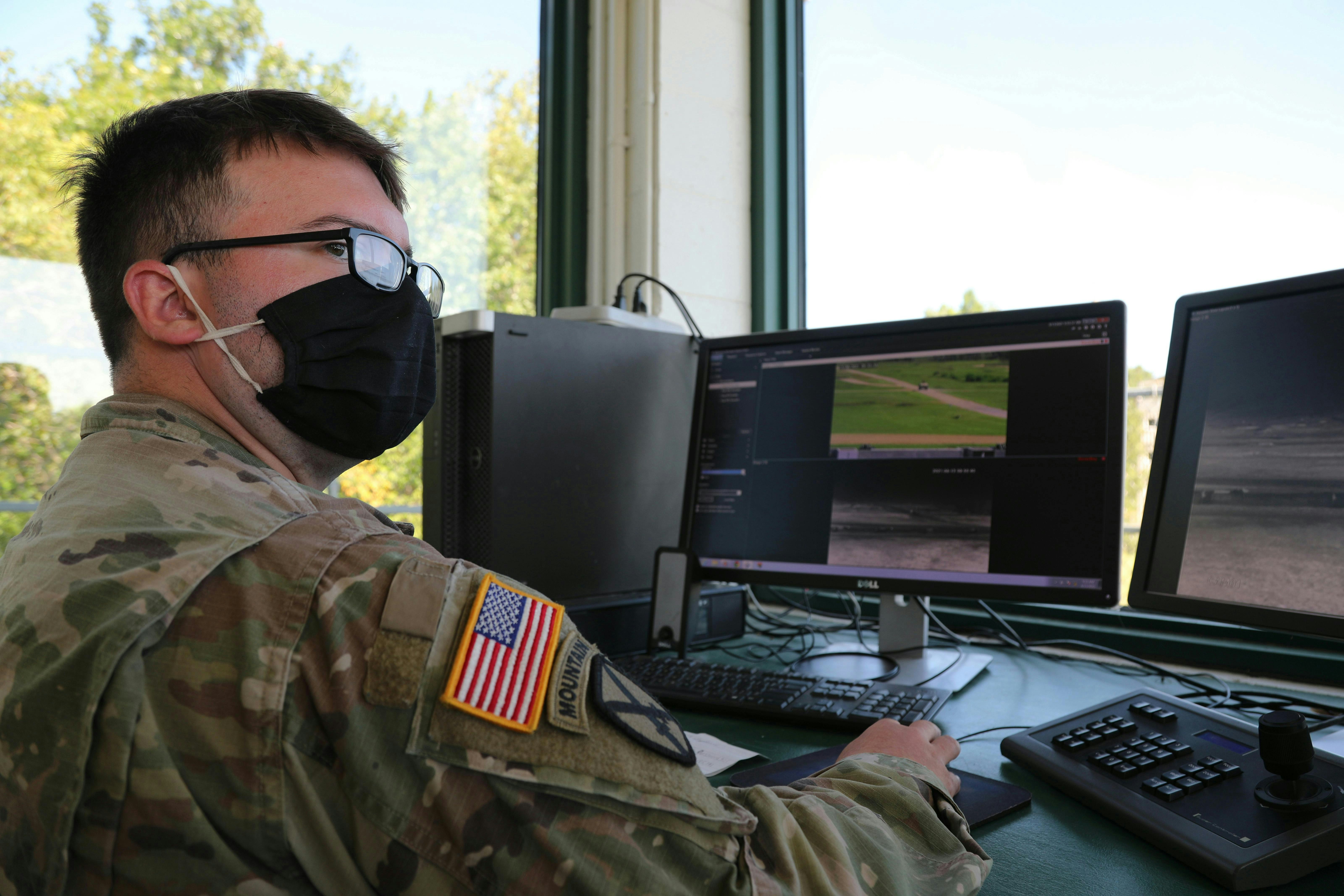 A U.S. Army operations specialist helps evaluate crew-served, vehicle-mounted weapons qualifications in 2021 at the Combat Support Training Exercise in Fort McCoy, Wis.