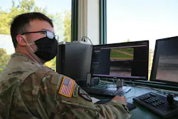 A U.S. Army operations specialist helps evaluate crew-served, vehicle-mounted weapons qualifications in 2021 at the Combat Support Training Exercise in Fort McCoy, Wis.
