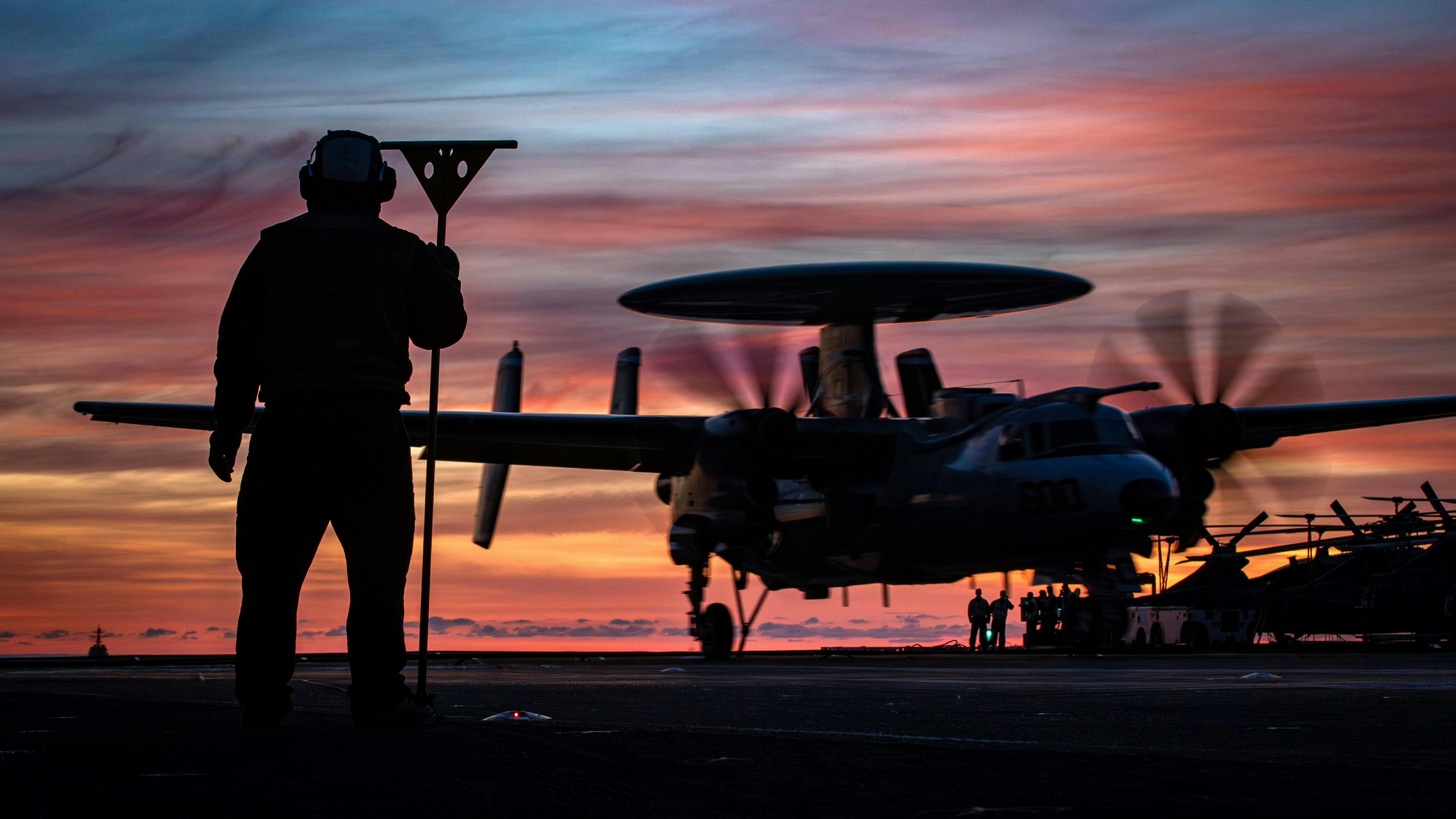 A Navy aviation boatswain&rsquo;s mate observes a Carrier Air Wing 8 E-2D Hawkeye of Airborne Command and Control Squadron 124, land on the flight deck of the aircraft carrier USS Gerald R. Ford , (CVN 78) last September.
